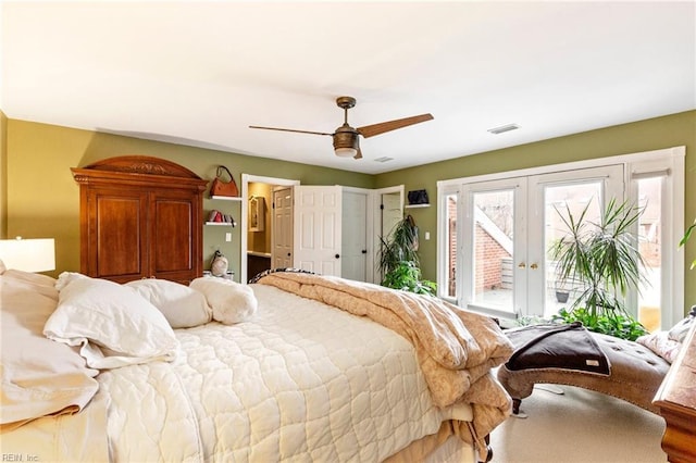 bedroom with access to outside, visible vents, ceiling fan, and french doors