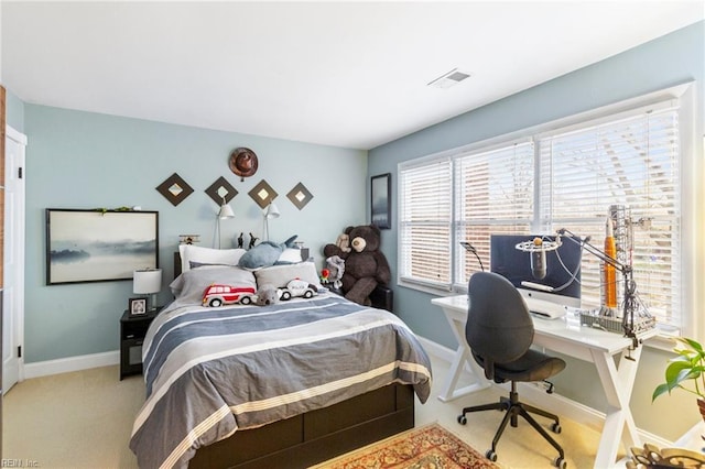 carpeted bedroom with baseboards and visible vents