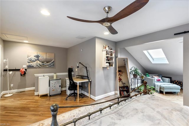 interior space featuring baseboards, a ceiling fan, lofted ceiling, wood finished floors, and recessed lighting