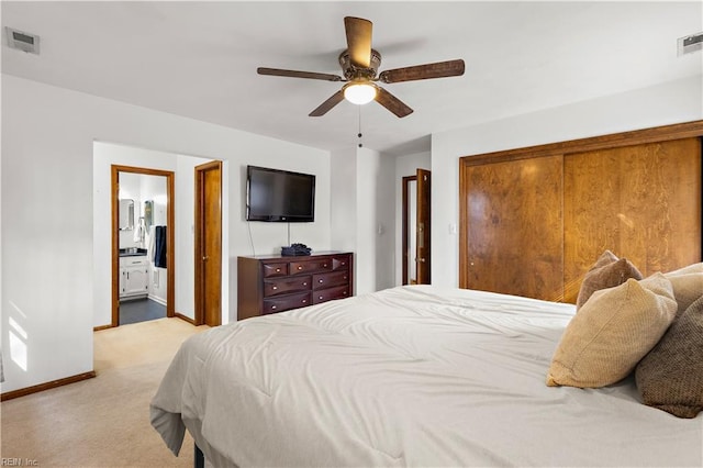 bedroom featuring baseboards, a ceiling fan, visible vents, and light colored carpet