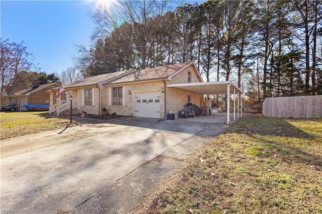 view of front of home featuring driveway, brick siding, fence, a carport, and a front yard