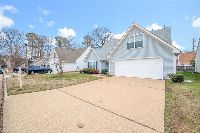 view of front of property featuring driveway, a garage, and a front lawn