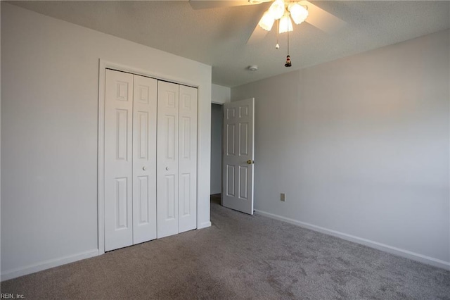 unfurnished bedroom featuring ceiling fan, carpet floors, a closet, and baseboards