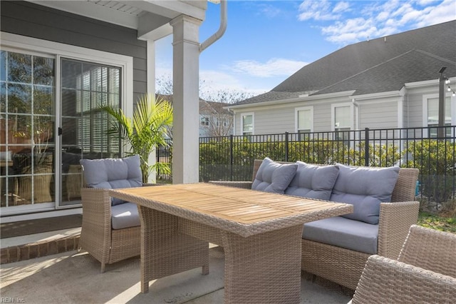 view of patio / terrace featuring outdoor dining space, outdoor lounge area, and fence