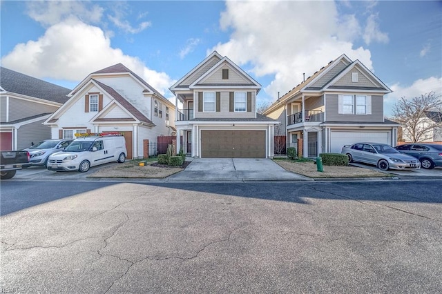 view of front facade with a garage, driveway, and a residential view