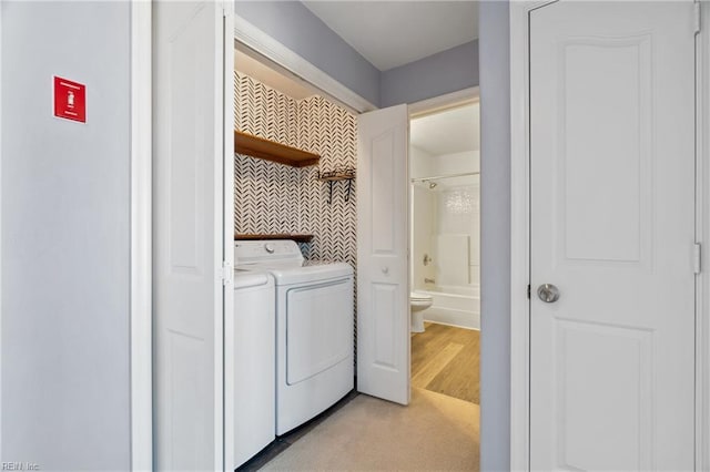 clothes washing area with laundry area and separate washer and dryer