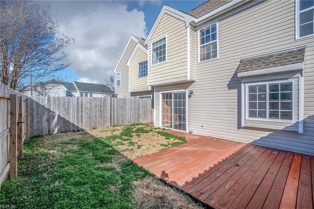 exterior space featuring a fenced backyard and a deck