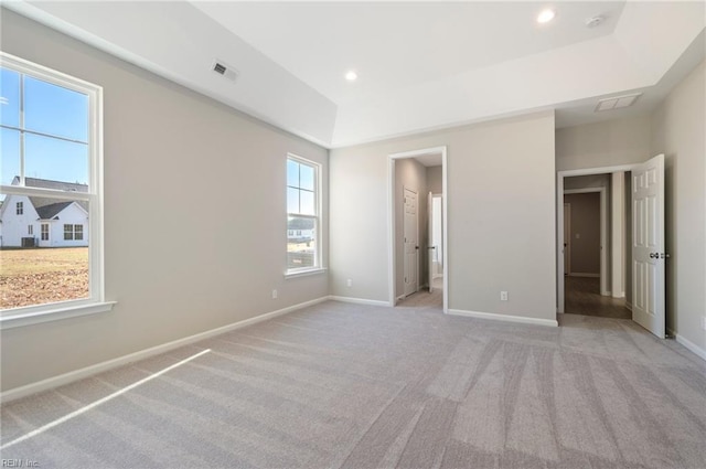 unfurnished bedroom featuring recessed lighting, visible vents, light carpet, and baseboards