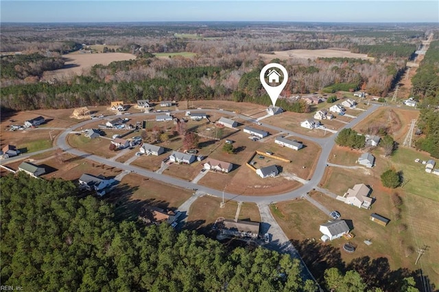 aerial view with a wooded view