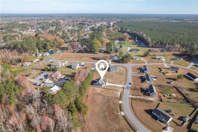 bird's eye view with a forest view