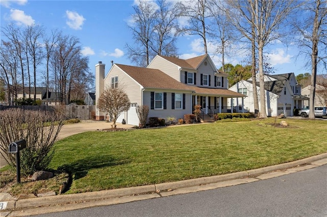 view of front of home featuring a chimney, a porch, concrete driveway, fence, and a front lawn