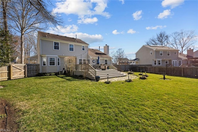 rear view of property with central air condition unit, a lawn, a deck, a residential view, and a fenced backyard