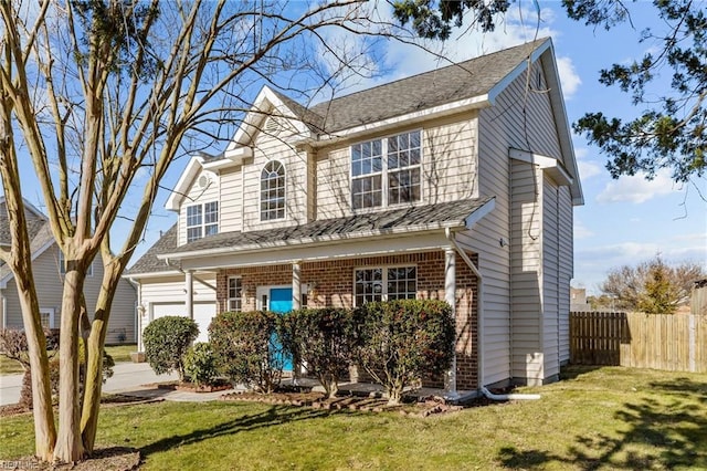 traditional-style house with fence, a front lawn, and brick siding