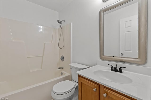 bathroom featuring toilet, bathtub / shower combination, and vanity