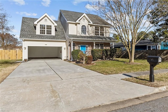 traditional home with a front yard, concrete driveway, roof with shingles, and fence