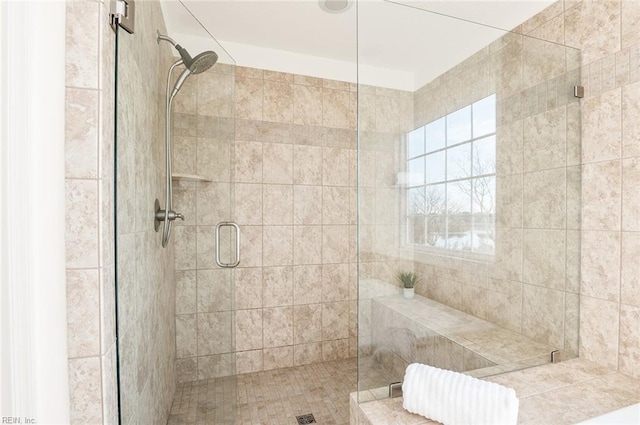 bathroom with a shower stall