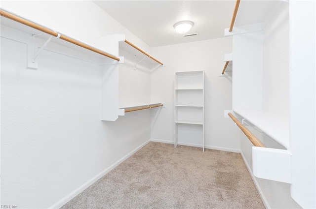 spacious closet with carpet and visible vents