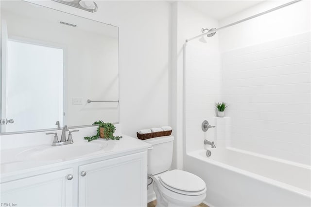 full bathroom featuring visible vents, vanity, toilet, and bathing tub / shower combination