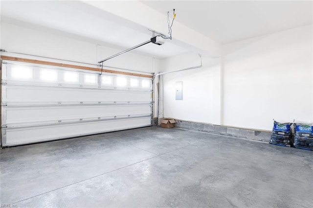 garage featuring electric panel and a garage door opener