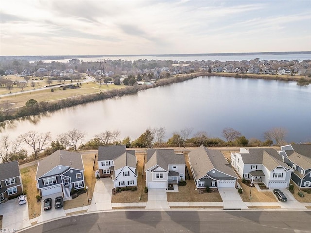 bird's eye view with a residential view and a water view