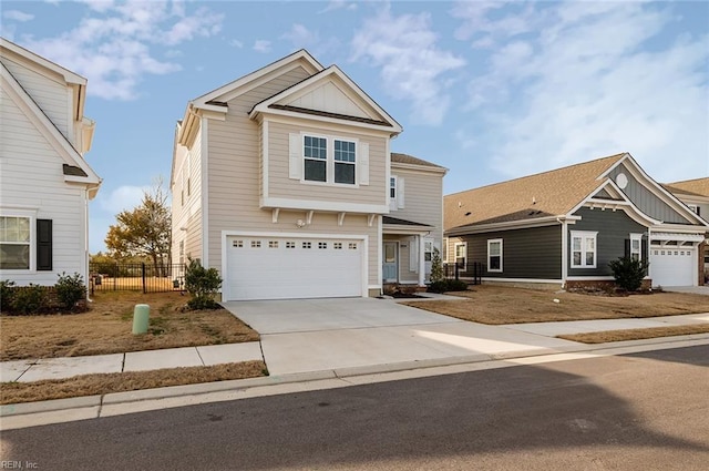 view of front facade featuring a garage, board and batten siding, fence, and concrete driveway