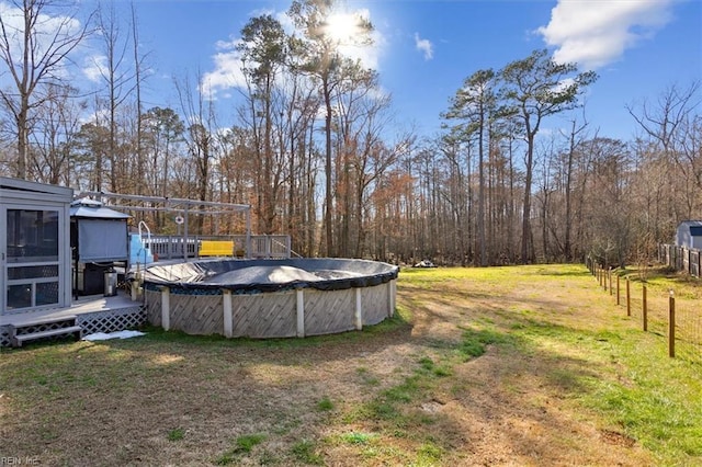 view of yard featuring a covered pool