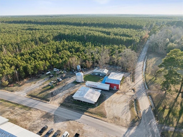 birds eye view of property featuring a wooded view
