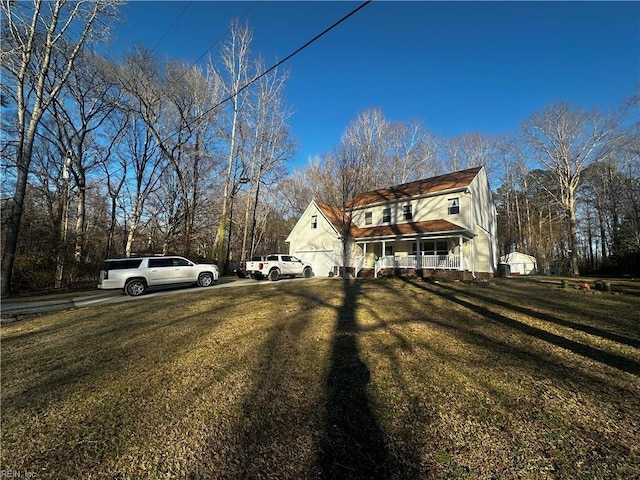 exterior space featuring a front lawn and a porch