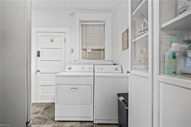 laundry area with laundry area, cooling unit, and washer and dryer