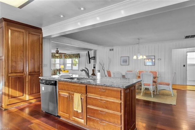 kitchen featuring stone countertops, visible vents, brown cabinetry, dishwasher, and a sink