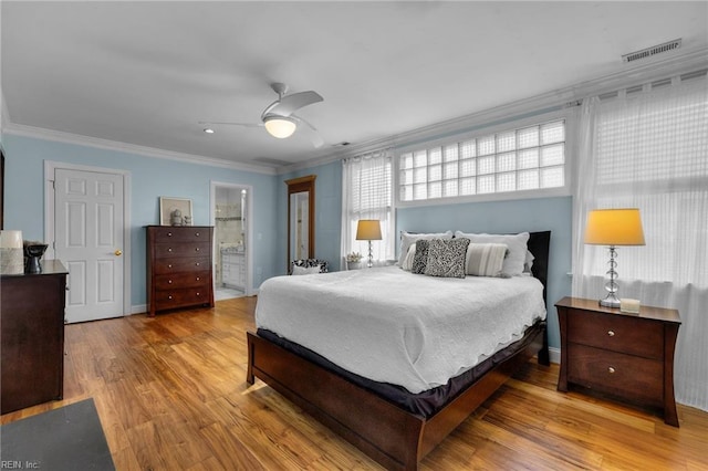 bedroom featuring baseboards, a ceiling fan, connected bathroom, light wood-style flooring, and ornamental molding