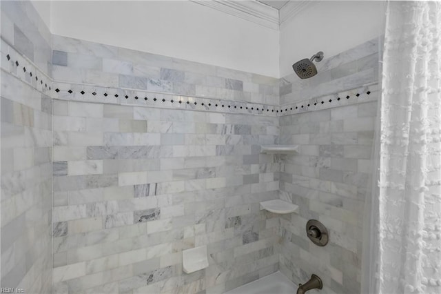 full bath with ornamental molding and shower / bath combo