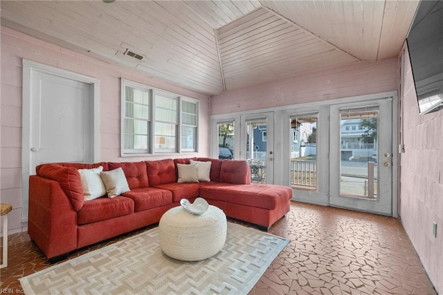 sunroom / solarium featuring lofted ceiling and wooden ceiling