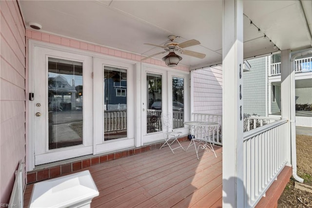 wooden deck with ceiling fan