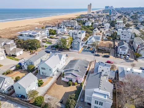 aerial view featuring a water view and a beach view