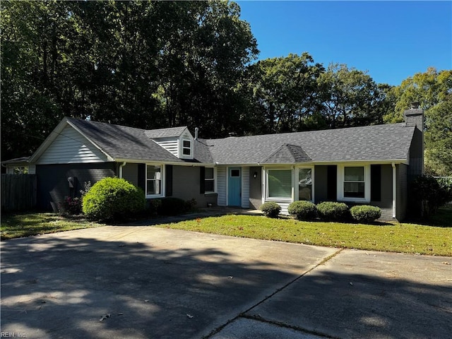 single story home with a front lawn and a shingled roof