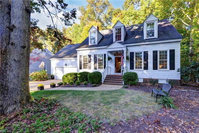 cape cod-style house featuring a garage, a front yard, crawl space, and driveway