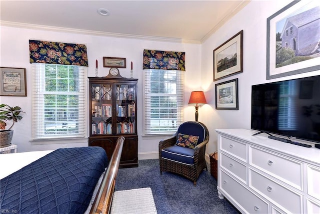 bedroom with dark colored carpet, ornamental molding, and baseboards