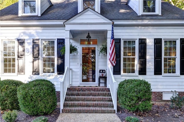 doorway to property featuring a shingled roof and crawl space