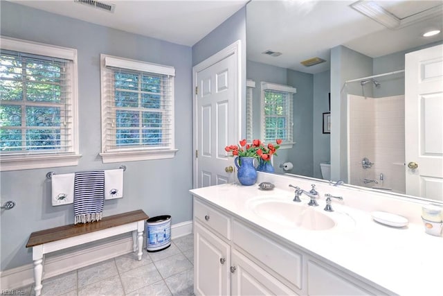 bathroom featuring toilet, tile patterned flooring, visible vents, and vanity