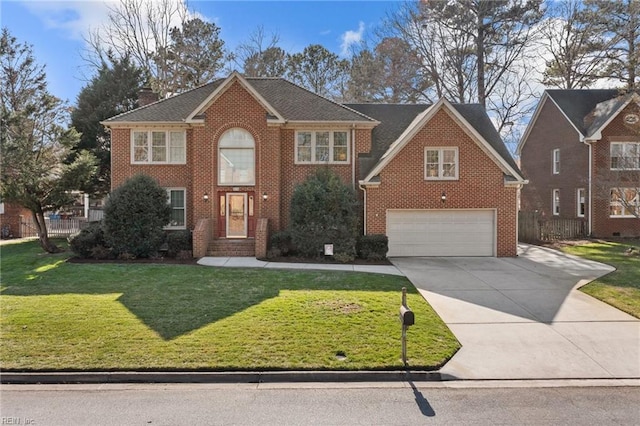 view of front facade with driveway, a garage, a front yard, and brick siding