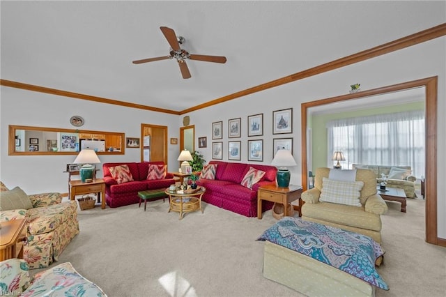 carpeted living room with ceiling fan and ornamental molding