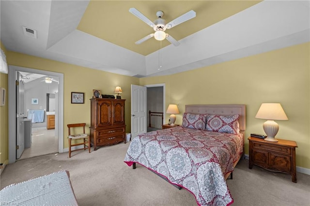 bedroom featuring carpet, a raised ceiling, visible vents, and baseboards