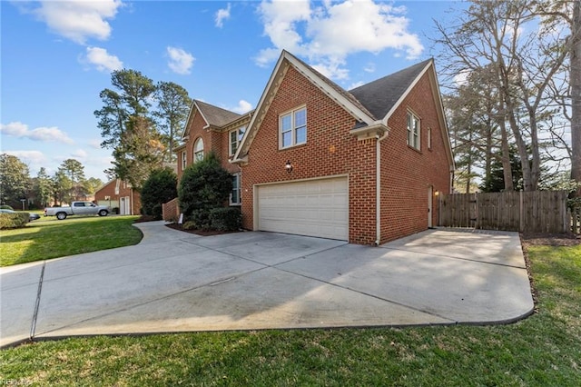 view of side of home with a garage, fence, concrete driveway, and brick siding