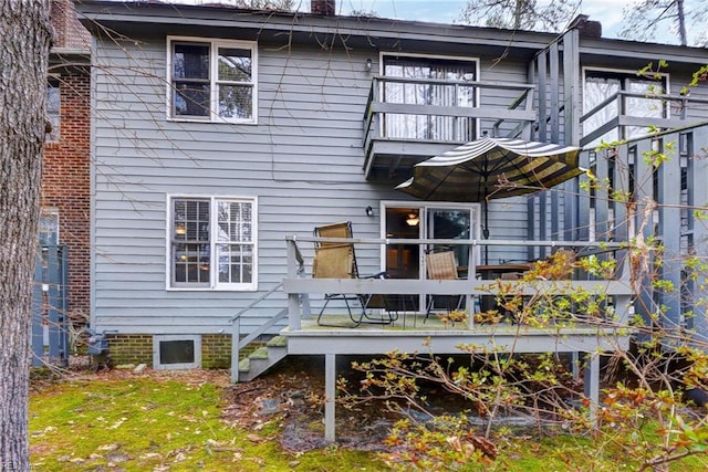 rear view of property with a balcony