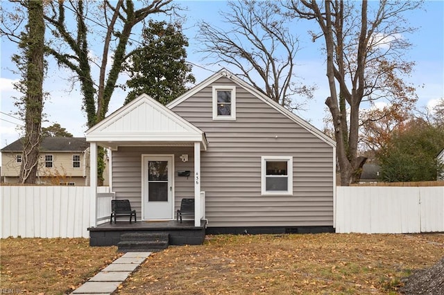 bungalow-style house featuring crawl space and fence