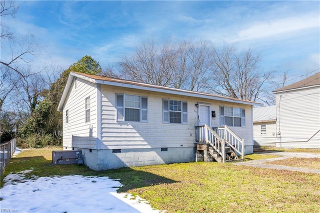 view of front of home with crawl space and a front lawn