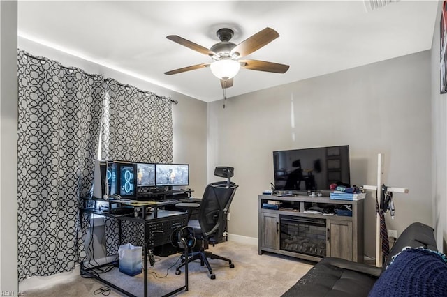 carpeted office space with visible vents, ceiling fan, and baseboards