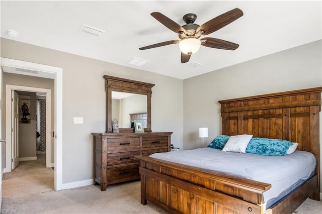 bedroom with baseboards, visible vents, a ceiling fan, and light colored carpet