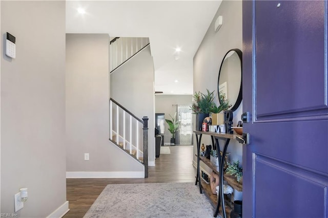 entrance foyer featuring recessed lighting, wood finished floors, baseboards, and stairs